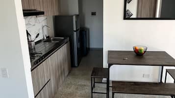 Fridge, microwave, stovetop, coffee/tea maker