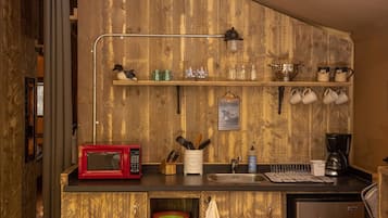 Mini-fridge, microwave, coffee/tea maker, cookware/dishes/utensils