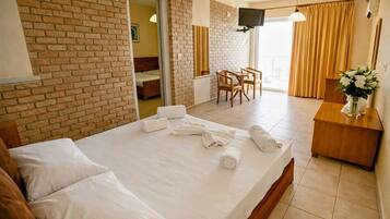 Family Quadruple Room, Beach View | Laptop workspace, free WiFi