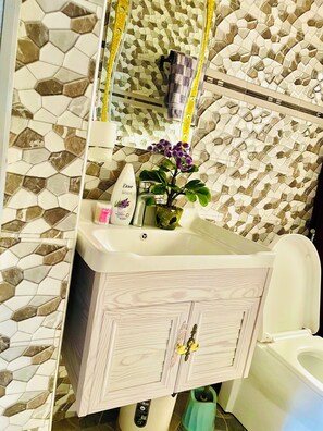 Shower, towels, soap, shampoo
