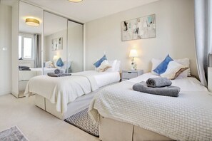 1 bedroom, desk, iron/ironing board, travel crib