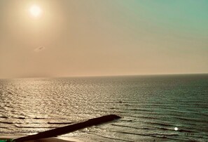 On the beach, sun-loungers