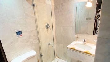 Separate bathtub and shower, hair dryer, towels, soap