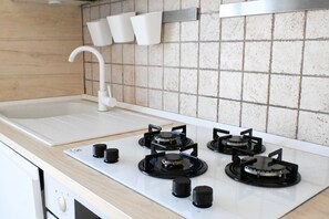 Een koelkast, een oven, een vaatwasser