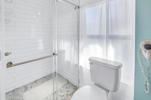 Shower, hair dryer, towels, soap