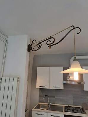 Fridge, coffee/tea maker, cookware/dishes/utensils