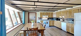 Spacious and cozy home with gas fireplace, boat dock, and lake views