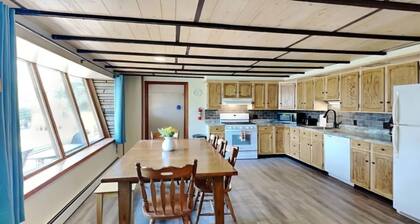 Spacious and cozy home with gas fireplace, boat dock, and lake views