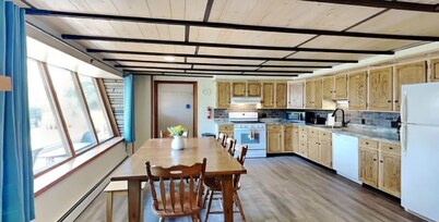 Spacious and cozy home with gas fireplace, boat dock, and lake views