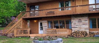 Spacious and cozy home with gas fireplace, boat dock, and lake views