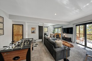 Smart TV, fireplace, foosball