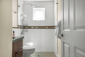 Shower, towels, soap, toilet paper