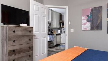 1 bedroom, desk, iron/ironing board, travel crib