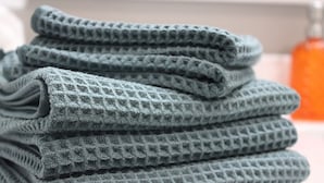 A stack of folded towels with a textured pattern. - Relax & Explore Downtown Little Rock (Little Rock)