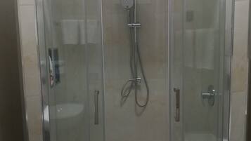 Shower, eco-friendly toiletries, hair dryer, bidet
