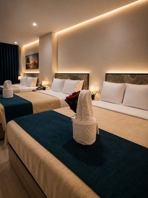 A hotel room with two beds, each with a headboard, bedside tables, lamps, and towels. - Royal Cairo Hotel (Cairo)