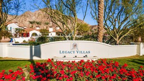 A sign for Legacy Villas with a clear view of the surrounding architecture and landscaping. - LV250 Upstairs 2 BDR Condo with Private Balcony (La Quinta)