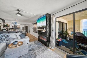 Smart TV, fireplace, books, stereo