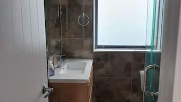 Shower, towels, toilet paper