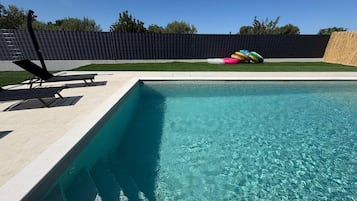 Outdoor pool, pool umbrellas, pool loungers