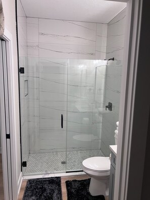 Shower, hair dryer, towels, soap