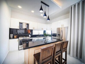 Fridge, microwave, stovetop, cookware/dishes/utensils