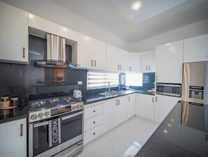 Fridge, microwave, stovetop, cookware/dishes/utensils