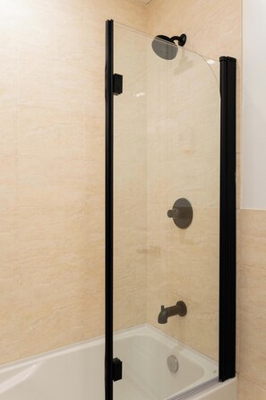 Shower, hair dryer, towels, shampoo