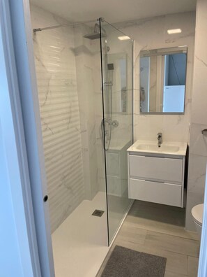 Shower, hair dryer, towels, soap