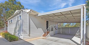 A single-story house with a covered garage and a staircase leading to the entrance. - The Rad Shack - Echuca Holiday Homes (Echuca)