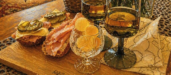A wooden table with glassware and food items. - Kirkkotien Kyly A Stylish Home With a Legendary Wood-burning Sauna in Finland (Ilomantsi)