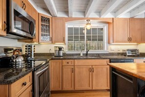 Fully equipped kitchen with counter seating 