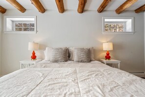 Bedroom 1 with queen bed, Smart TV, and ensuite 