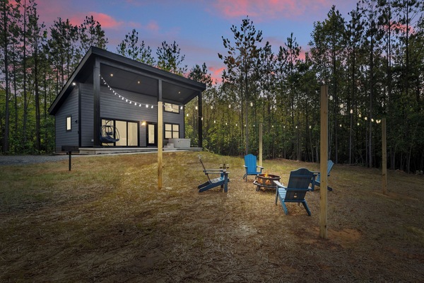 Fire pit with string lights for relaxing and roasting marshmallows.