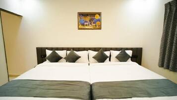 Luxury Studio Suite, City View | In-room safe, desk, laptop workspace, blackout curtains