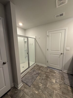 Shower, towels, soap, toilet paper