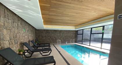 Coastal apartment, steps from the beach. Heated swimming pool, jacuzzi and patio