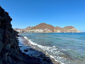On the beach, sun-loungers, beach towels
