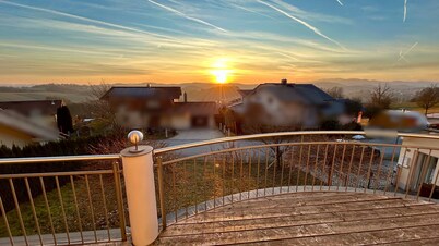 Spacious vacation home with views of the Alps, large balcony and terrace.