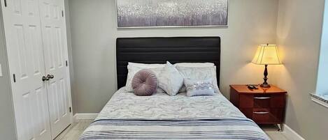 1 bedroom, desk, iron/ironing board, travel crib