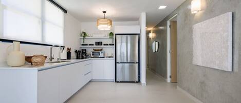 Fridge, microwave, stovetop, coffee/tea maker