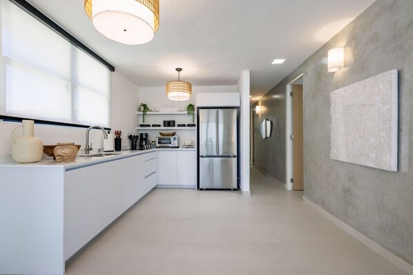 Fridge, microwave, stovetop, coffee/tea maker