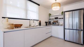 Fridge, microwave, stovetop, coffee/tea maker