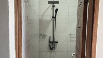 Deluxe Double Room, Ocean View, Beachside | Bathroom | Shower, towels, soap, toilet paper