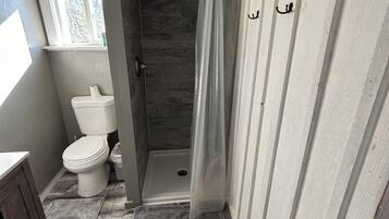 Shower, towels, soap, toilet paper