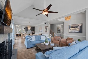 Smart TV, fireplace, books, stereo