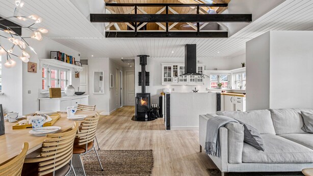 A modern interior with a dining area, kitchen, and living space. - Pet friendly home in Blokhus with WiFi (Blokhus)