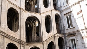 A multi-story building with large arched windows and balconies. - San Felice Palace (Naples)