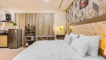 1 bedroom, desk, iron/ironing board, travel crib