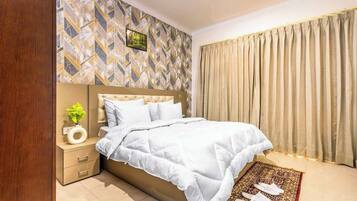 1 bedroom, desk, iron/ironing board, travel crib